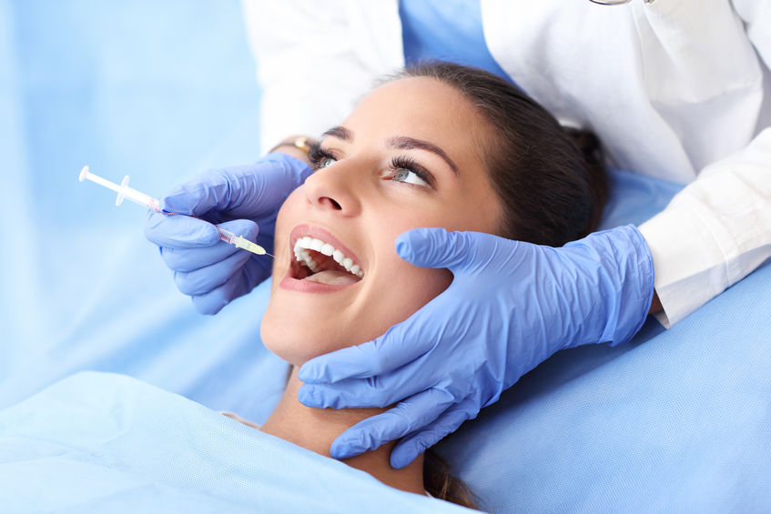 root canal Adult woman having a visit at the dentist's
